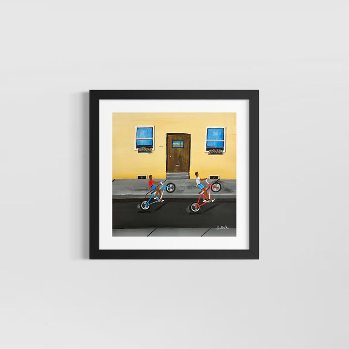 two boys hitting wheelies on back wheel bicycle bike outside house with door and windows