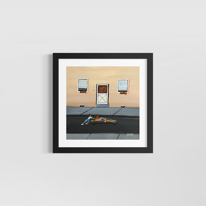 two boys playing race car in street outside of house with door and windows