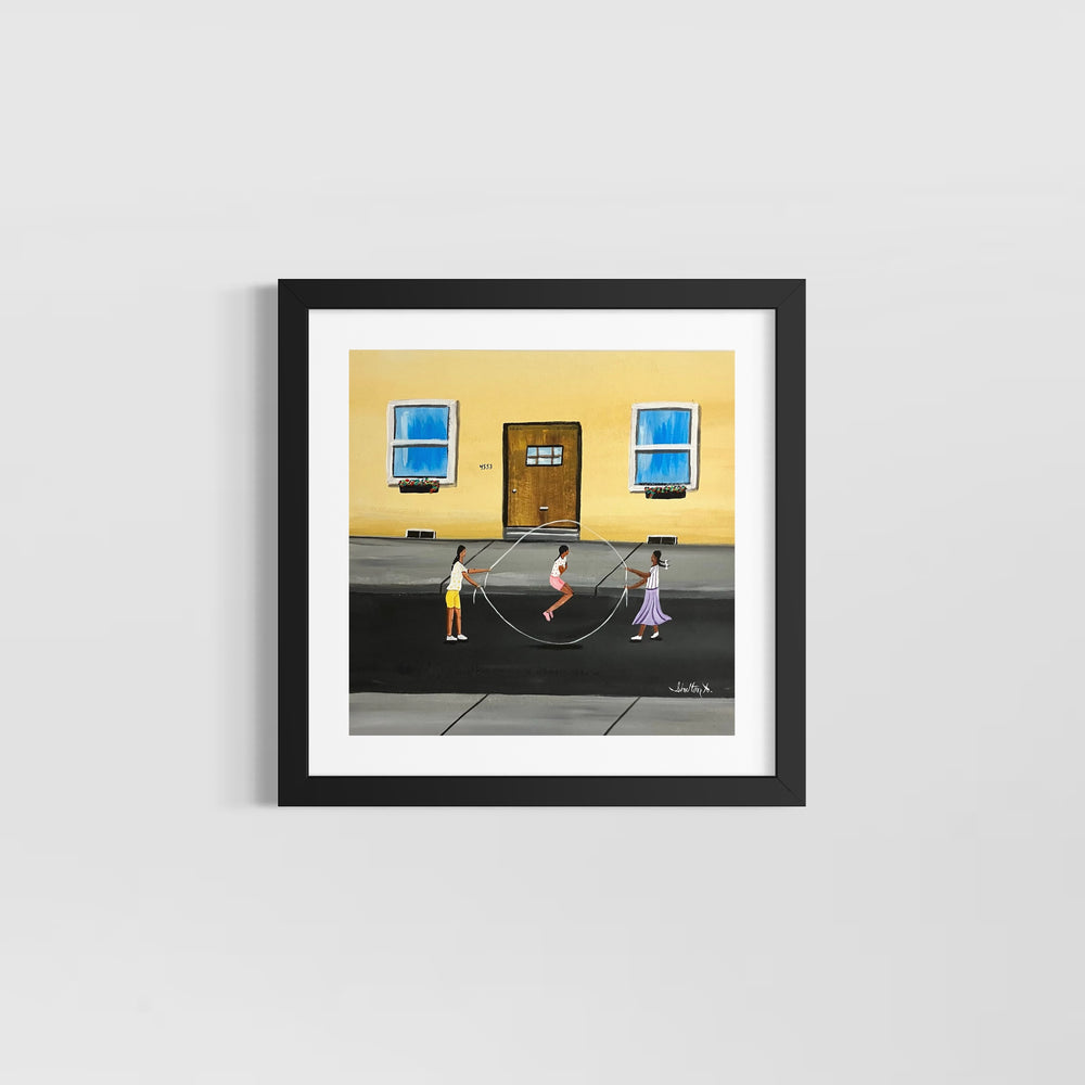 three girls playing jump rope double dutch outside in street in front of yellow house