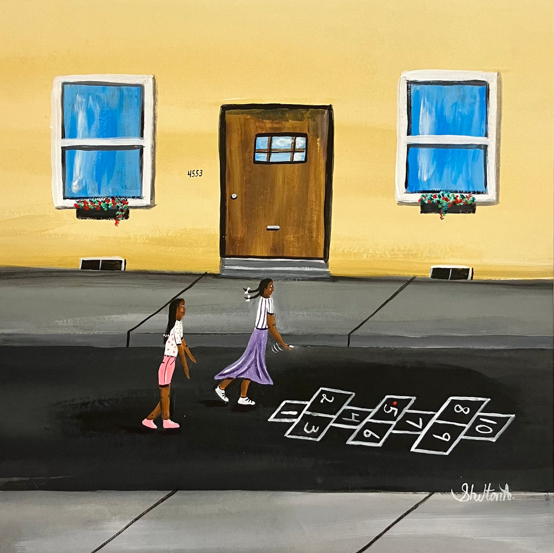 two girls playing hopscotch outside chalk street in front of house with door and windows