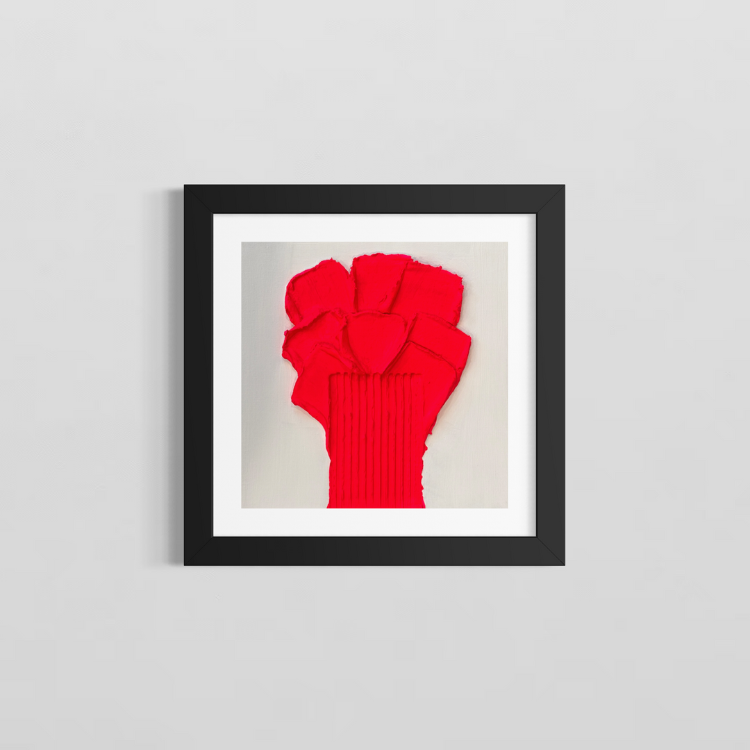 Lee in Cerulean, Botanic Rose, joint compound and acrylic, 14 x 14 inches, shown in a black frame with a white mat on a light grey wall. A pinkish-red flower-like form of layered petal shapes on a vertically ribbed stem, on a white background.