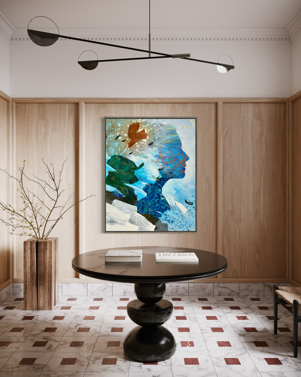 Current Cameo by Christopher Peter displayed in a modern interior, hung on a warm wood-paneled wall above a dark round pedestal table, with a sculptural chandelier overhead and decorative branch vase alongside.