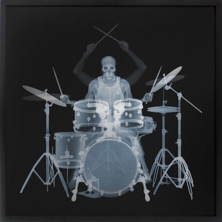 Framed Lenticular black and white x-ray photograph by Nick Veasey of a skeletal drummer 
