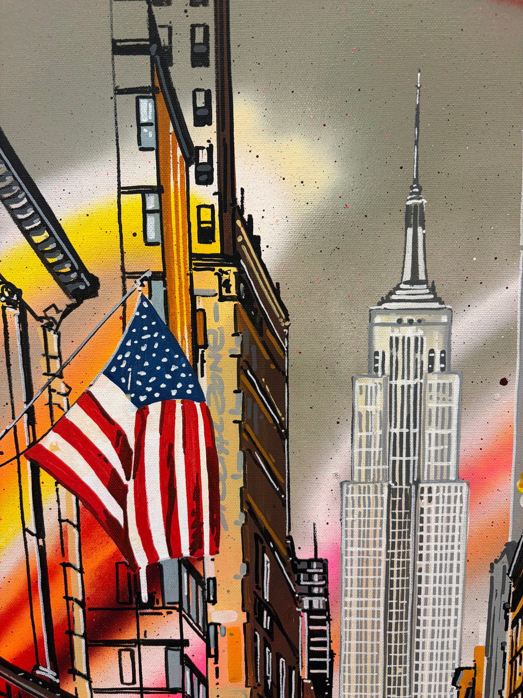 Angled close-up detail of "Empire State of America" acrylic graffiti painting by Pappay, showing the Empire State Building spire and a large American flag
