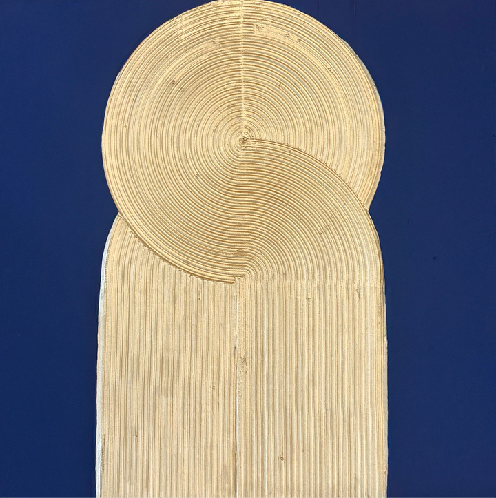 swirled circular golden pillar with line ridges texture on blue background