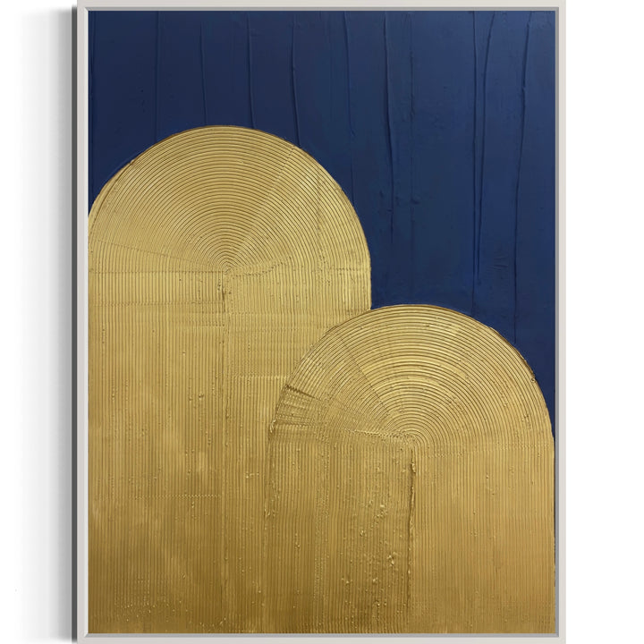 two rounded bump hill shapes in gold with textured directional lines in arch shape, on textured blue background