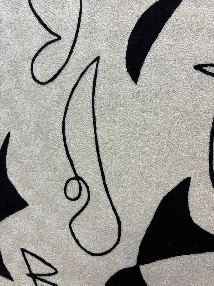 abstract shapes doodles line work in black and white negative space solid heavy chain stitched textile fabric embroidery