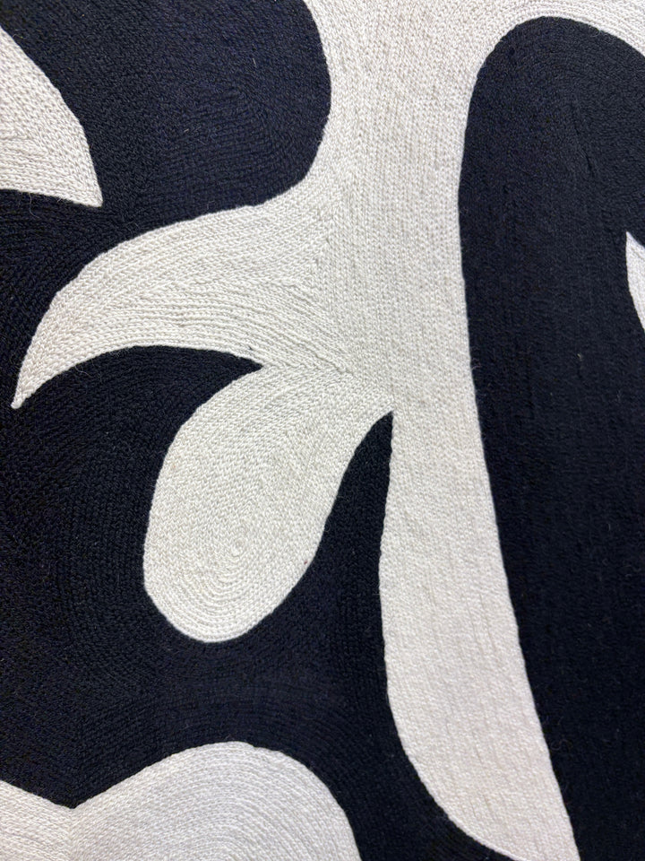 chain stitched textile embroidery abstract black and white negative space pattern shapes in wood frame