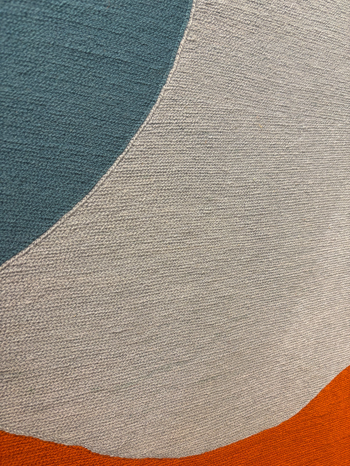 chain stitched embroidery fabric textile framed geometric abstraction blue green orange shapes negative space