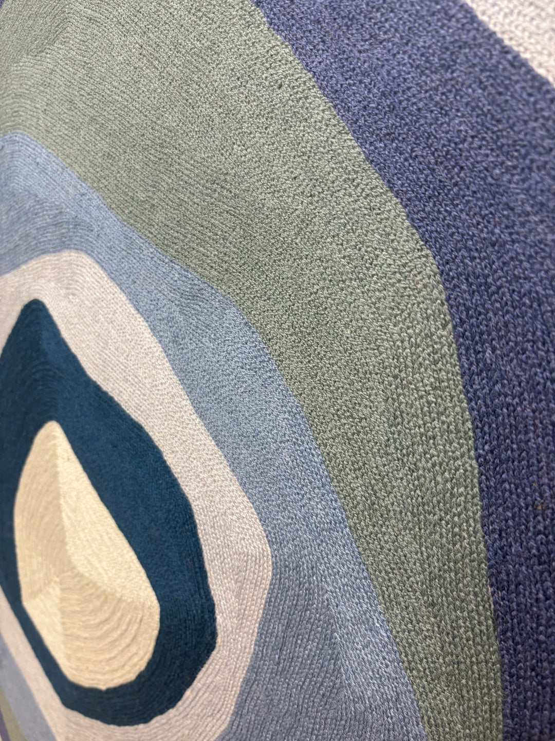 43"x42.5" chain-stitched textile with blue hues in a geometric form. 