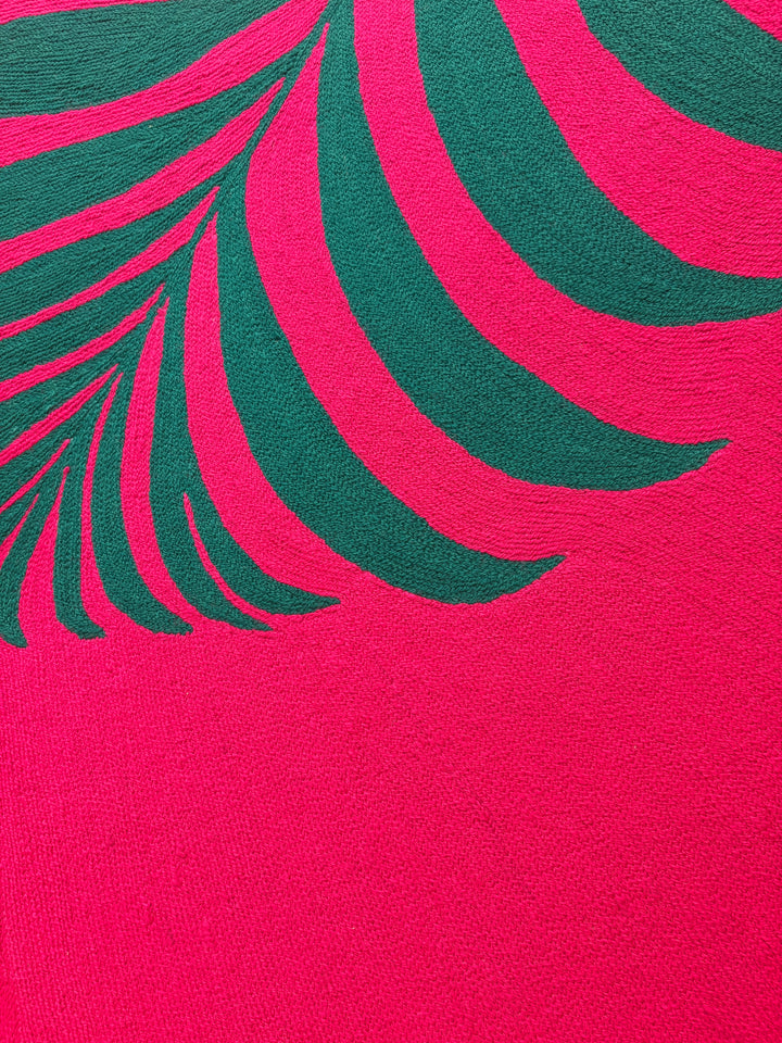 42.5"x42.5" chain-stitched textile with a tropical leaf over a bright pink background. 