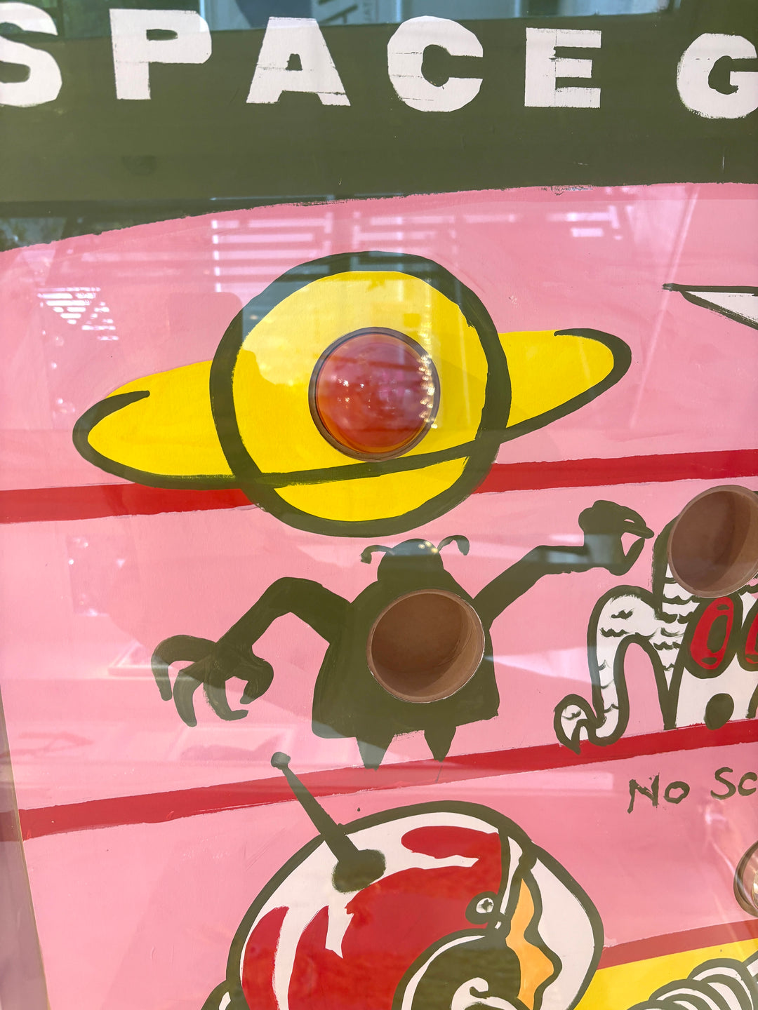 Vintage retro game child kid nostalgia graphic jiggle puzzle painting with acrylic in pink yellow and green balls inside glass box with holes 