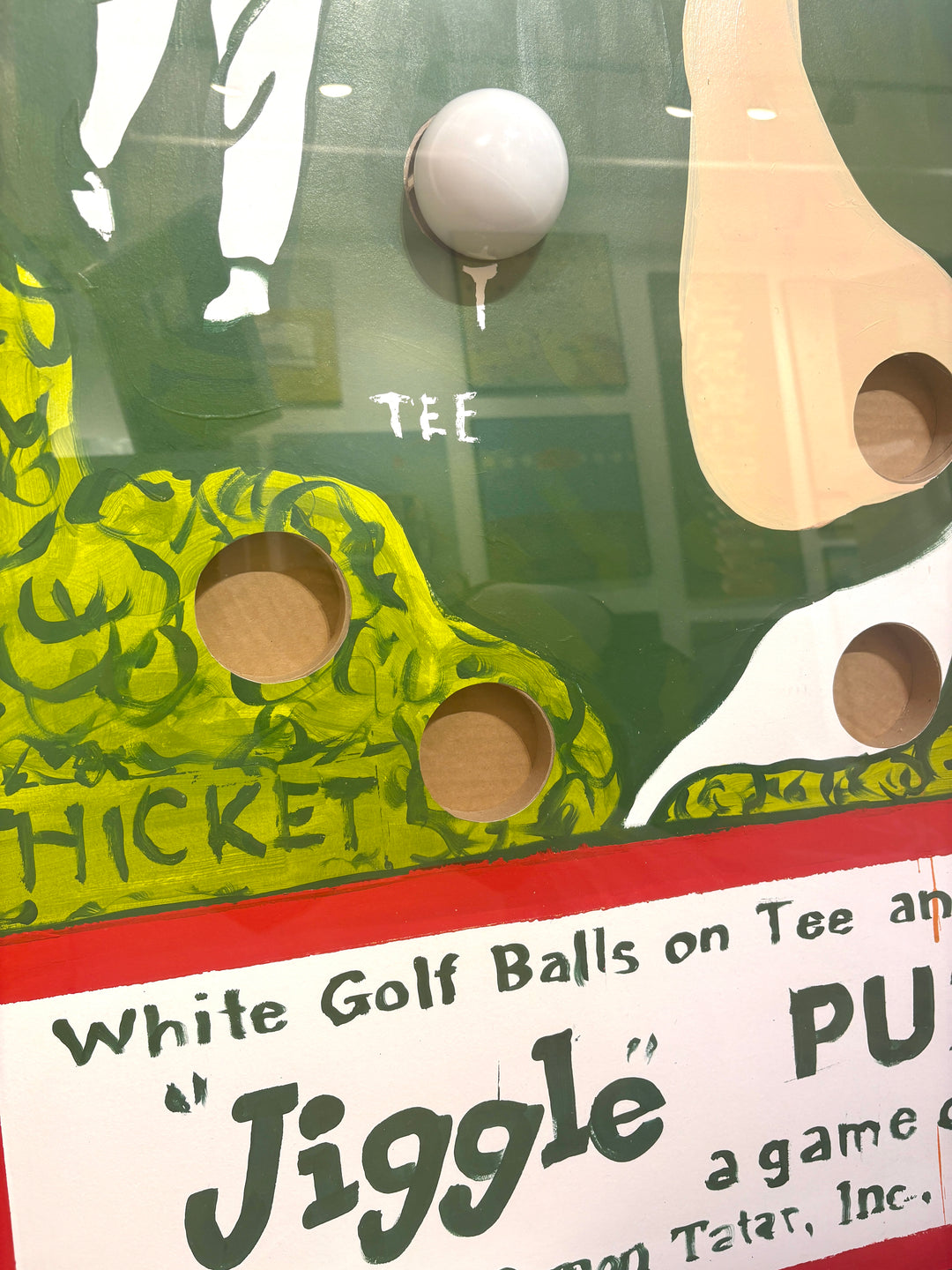 Graphic vintage nostalgic jiggle puzzle game with balls green golfing with hitting figure golf map tee. and holes in acrylic and plexiglass frame