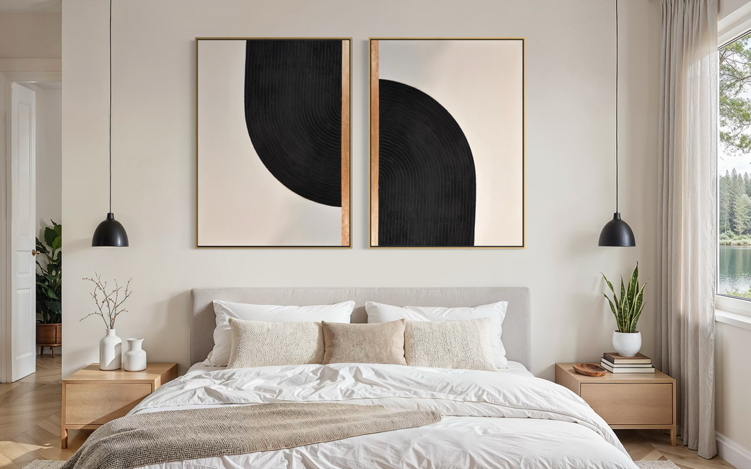 Lee in Cerulean, Interstellar Duo, joint compound and acrylic paint on canvas, 36 x 48 inches each (72 x 48 inches together). Two black, cream, and gold textured panels hung side by side above a bed with white linens, flanked by light wood nightstands and black pendant lights.