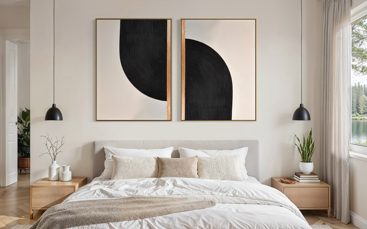 Lee in Cerulean, Interstellar Duo, joint compound and acrylic paint on canvas, 36 x 48 inches each (72 x 48 inches together). Two black, cream, and gold textured panels hung side by side above a bed with white linens, flanked by light wood nightstands and black pendant lights.