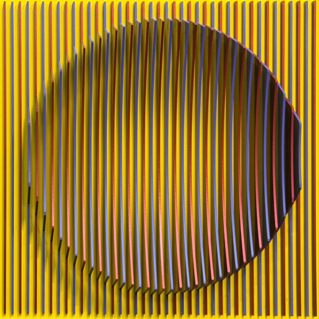 geometric abstract vertical lines concave optical illusion of a circular shape in middle in yellow red and blue