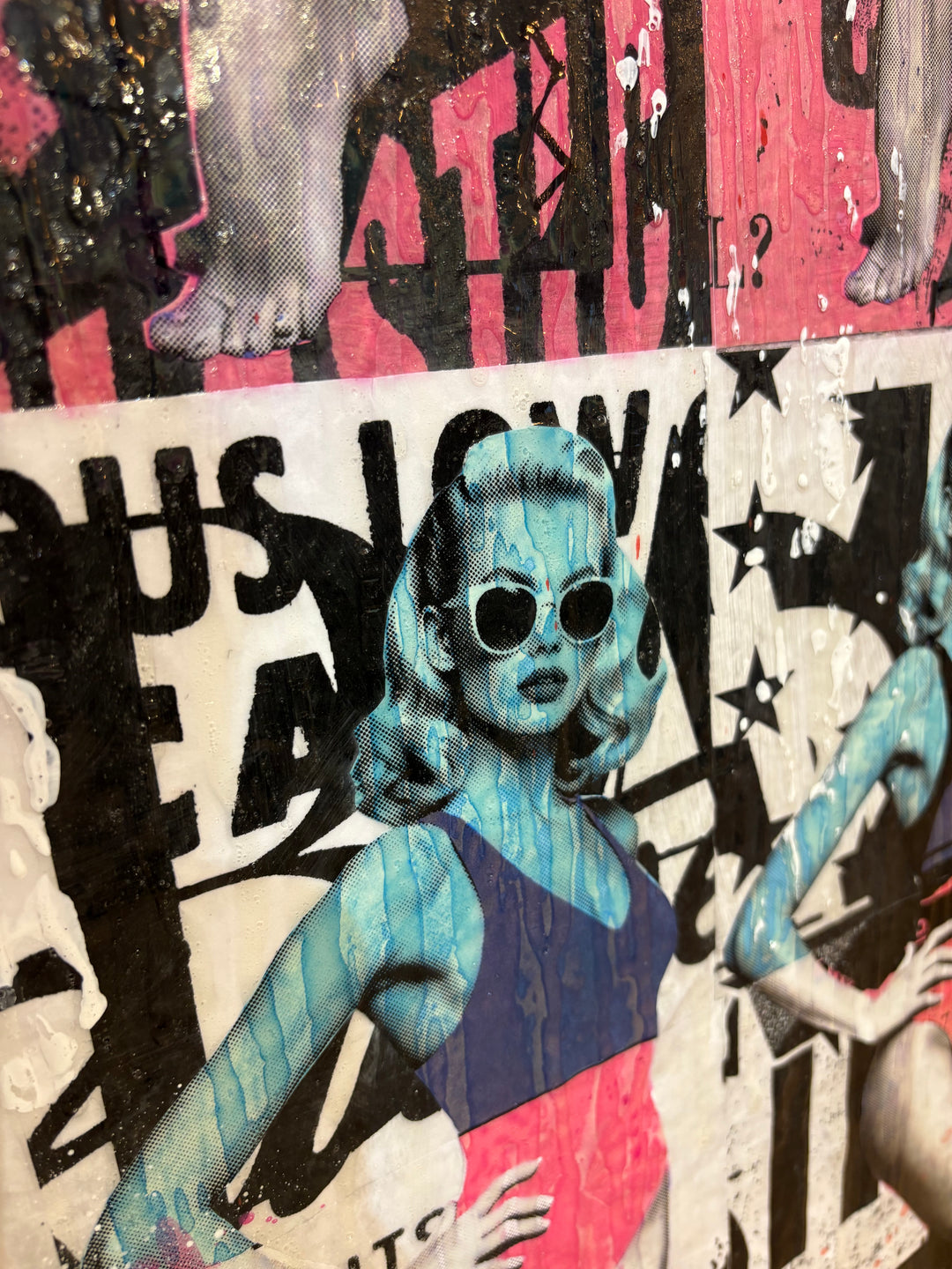 Picture Perfect by Jon Davenport — angled detail of Neo-Pop mixed media painting showing a blue-toned pin-up figure in sunglasses against bold black and white poster typography