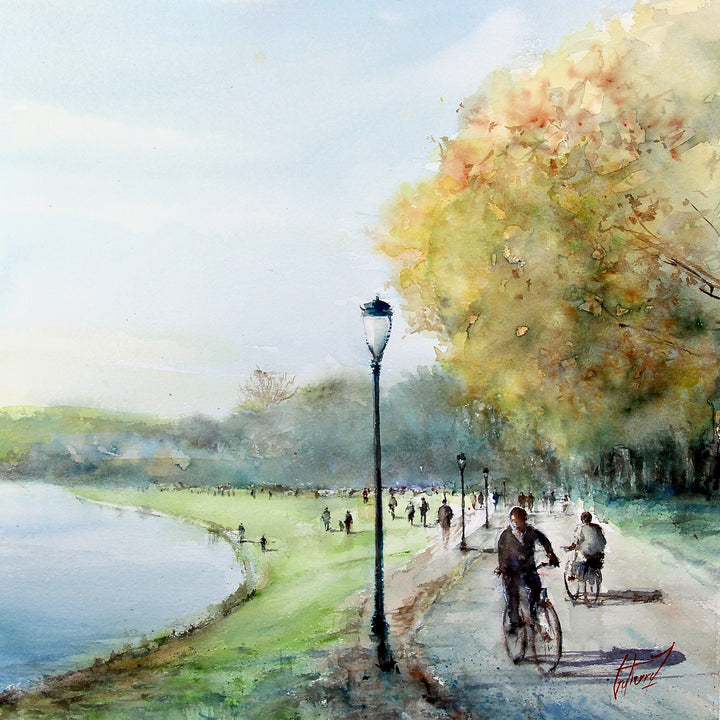 pedestrians walking and biking along trail next to river with street lamp in washy watercolor painting with fall autumn trees in orange yellow green and blue