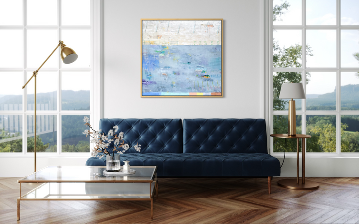 abstract blue, silver and gold mixed media 40X42 canvas with expressive colorful marks throughout in a living room setting