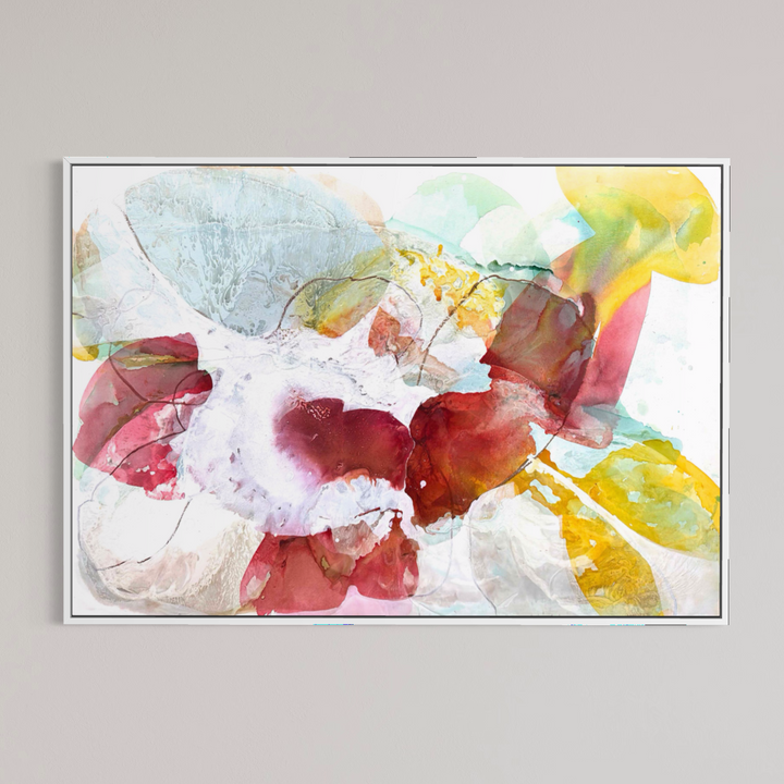 Liz Barber, Tide Pool 2, acrylic paint, ink, watercolor, and graphite on canvas, 72 x 50 inches. Horizontal abstract composition of overlapping translucent shapes in crimson, rose pink, golden yellow, pale blue, and white with fine graphite lines around a white center, shown in a thin white frame on a light gray wall.