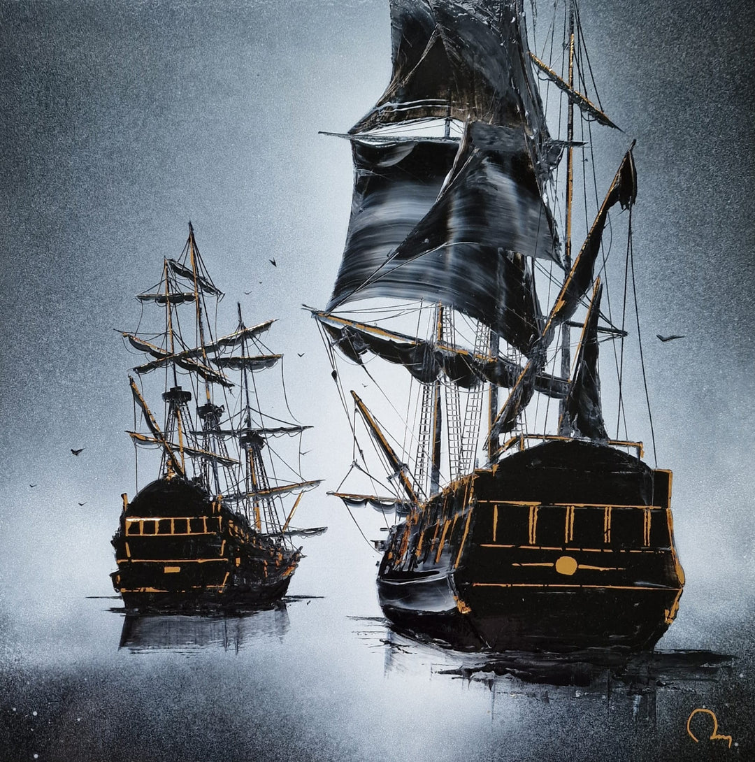 "Travelling" by French artist Julien Rey — a mixed-media painting on board of two tall ships at sea, crafted with Chinese lacquer and gold leaf. Two dramatic black galleons with billowing sails and gold leaf rigging emerge from a misty silver-gray ocean, their hulls and stern details richly accented in gold. Seabirds drift through the atmospheric haze above still, reflective waters. Original contemporary nautical tall ship painting on board available at Morton Contemporary gallery.