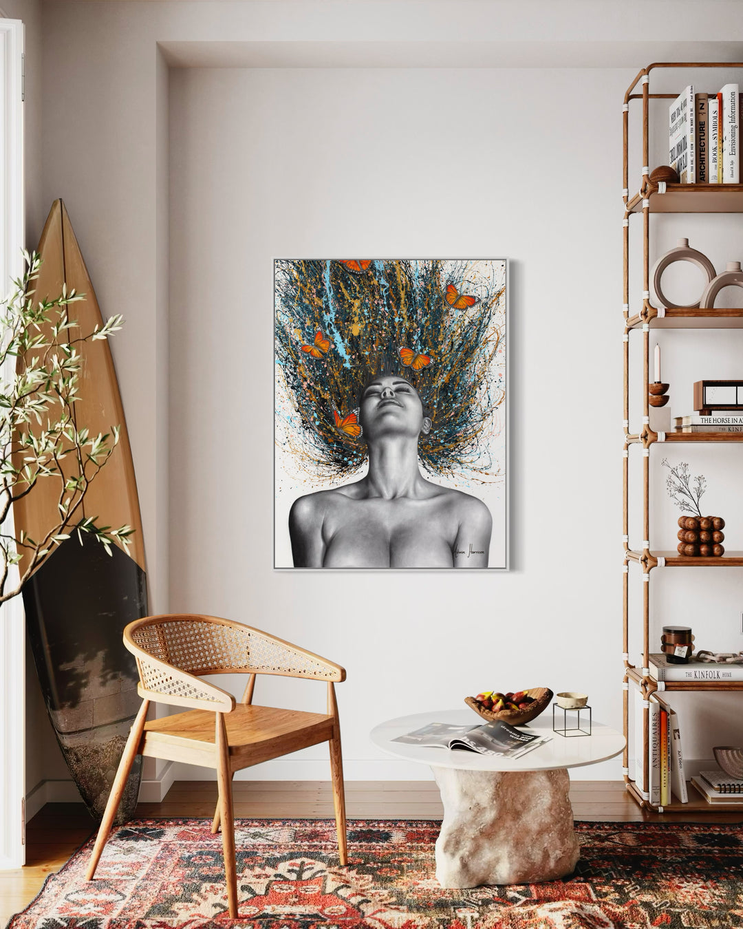 black and white woman flipping hair back with gold blue and black splatter paint, orange monarch butterflies in hair on white background