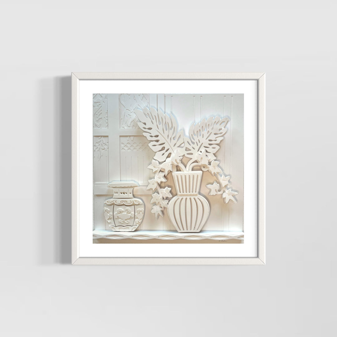 14"x14" layered white paper forming a fern in a striped vase on a wall. 