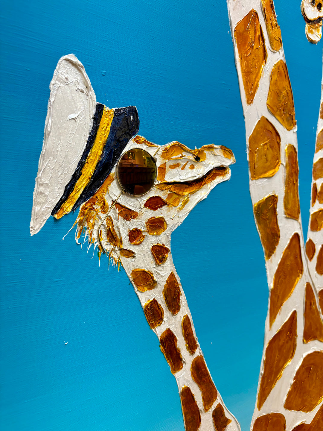 60" x 60" acrylic on canvas painting of giraffes with hats and sunglasses over a blue gradient background. 
