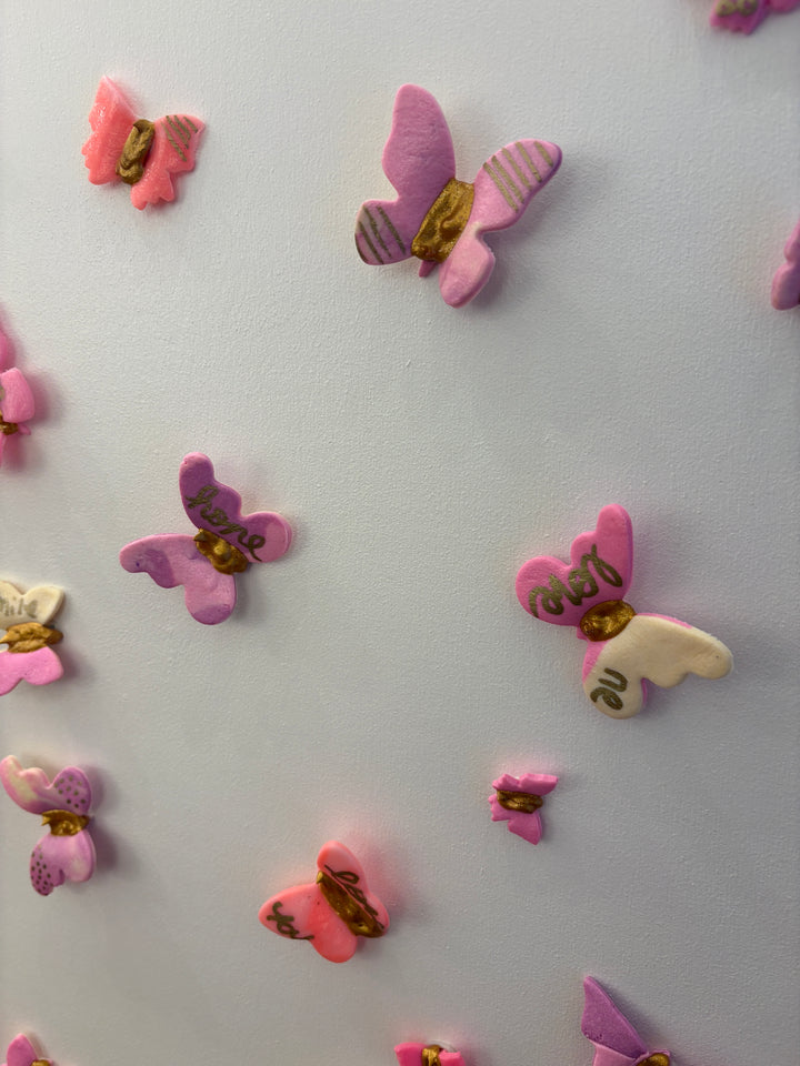 Acrylic clay and modeling paste painting of bottle champagne of pink 3 dimensional flowers coming out of bottle to butterflies on white canvas