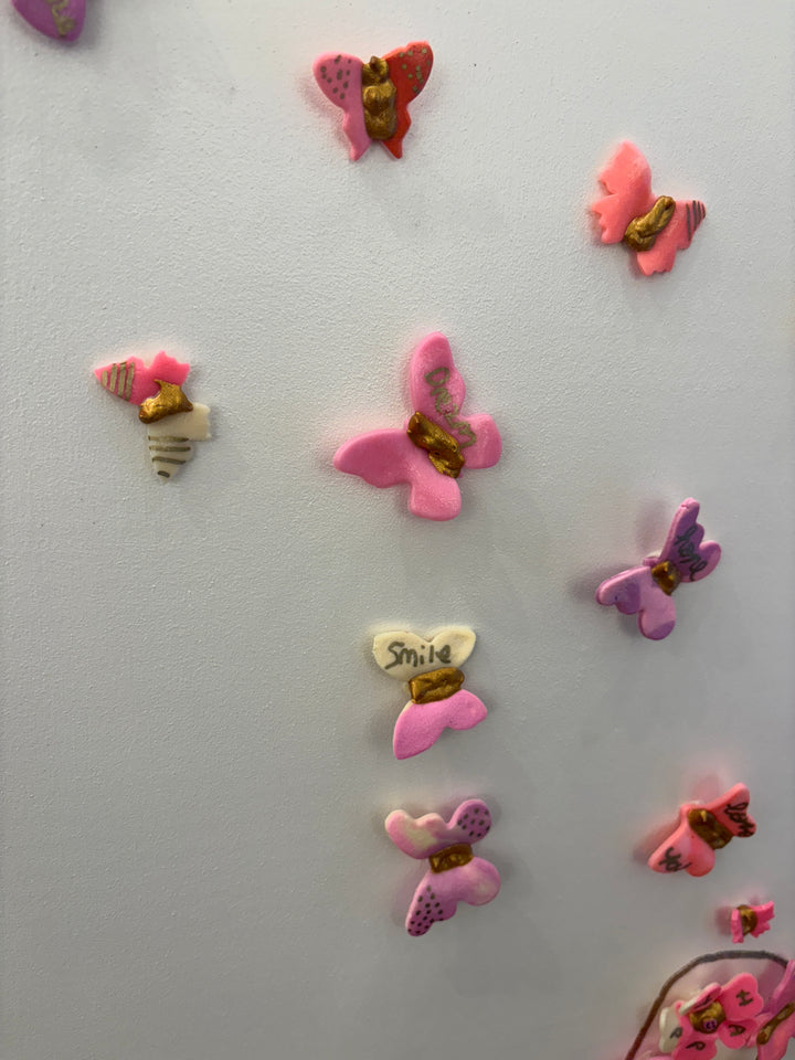 Acrylic clay and modeling paste painting of bottle champagne of pink 3 dimensional flowers coming out of bottle to butterflies on white canvas